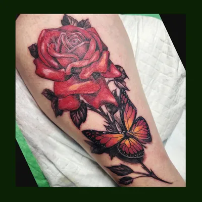 Rose and butterfly tattoo