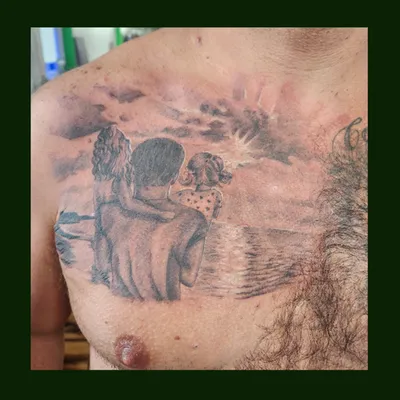 Sunset chest tattoo