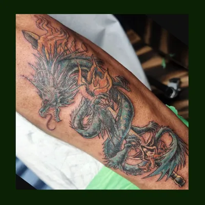 Dragon and sword tattoo